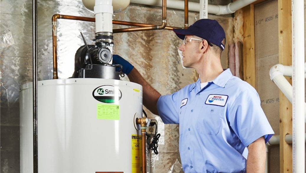 Free photo worker repairing water heater