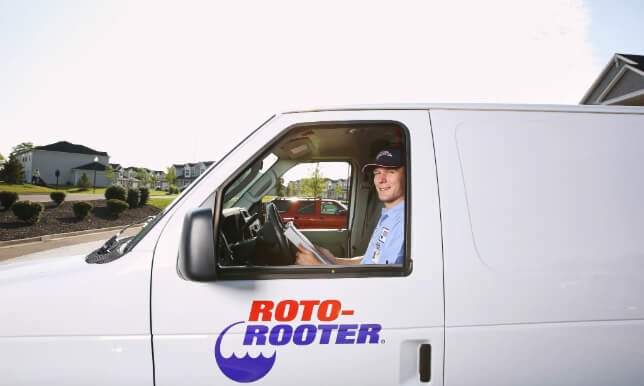 Roto-Rooter tech in van